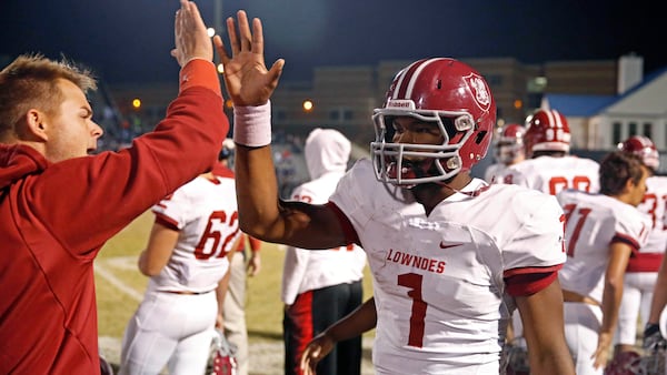  Lowndes quarterback Michael Barrett (1) celebrates his long touchdown run against Norcross during the second round of the Class AAAAAAA playoffs. (Jason Getz/For the AJC)