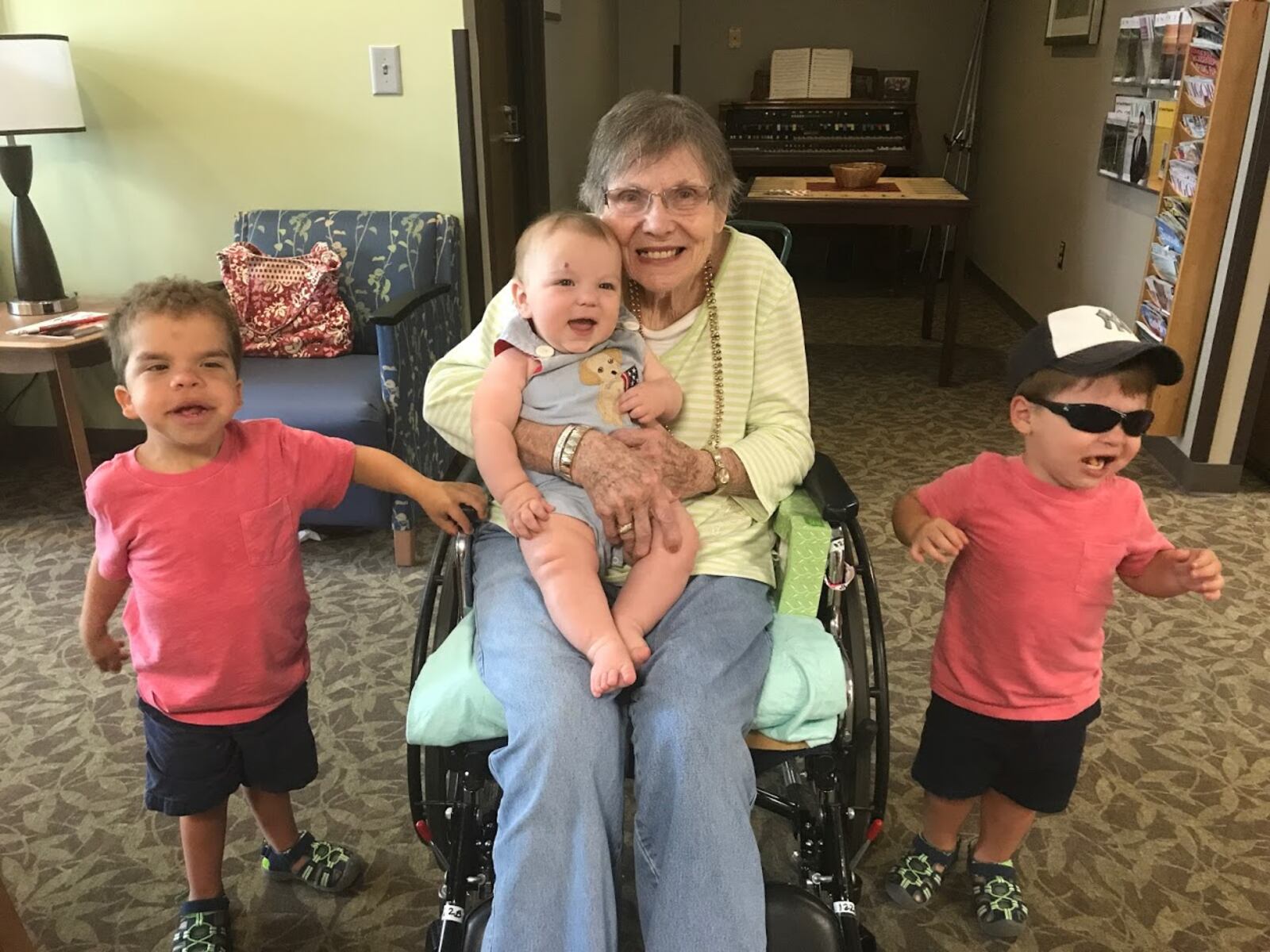 The author's grandmother, Peggy Hughes, visits with her great-grandsons, Max (from left), Beau, and Duke Janton at Northside Gwinnett Extended Care Center.
Courtesy of Keri Janton