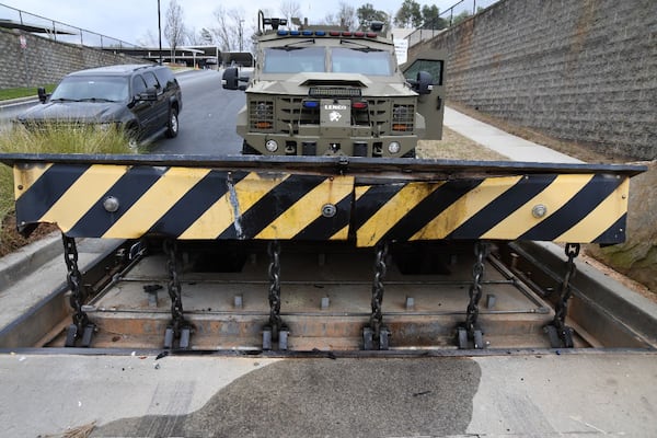 Photos from the affidavit for a federal arrest warrant show the damage to a security barrier caused by a Buick Encore ramming it April 1. Courtesy of FBI