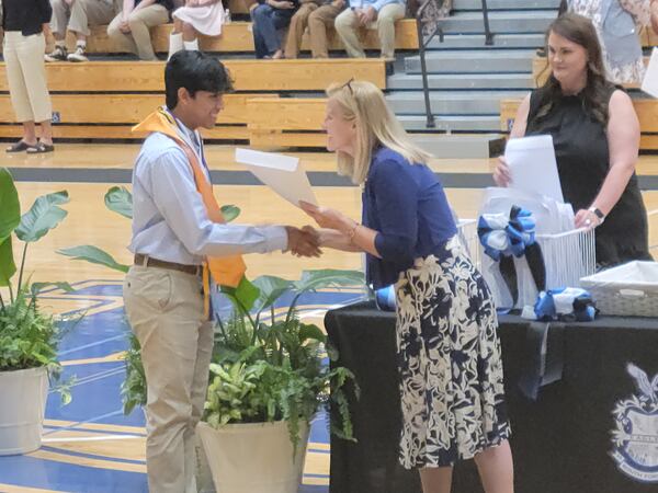 Ayush Gundawar, left, is among three Georgia high school students named as 2022 U.S. Presidential Scholars. The senior at South Forsyth High School founded LearnForsyth, an online learning platform, to help students in the early months of the COVID-19 pandemic. (Contributed)