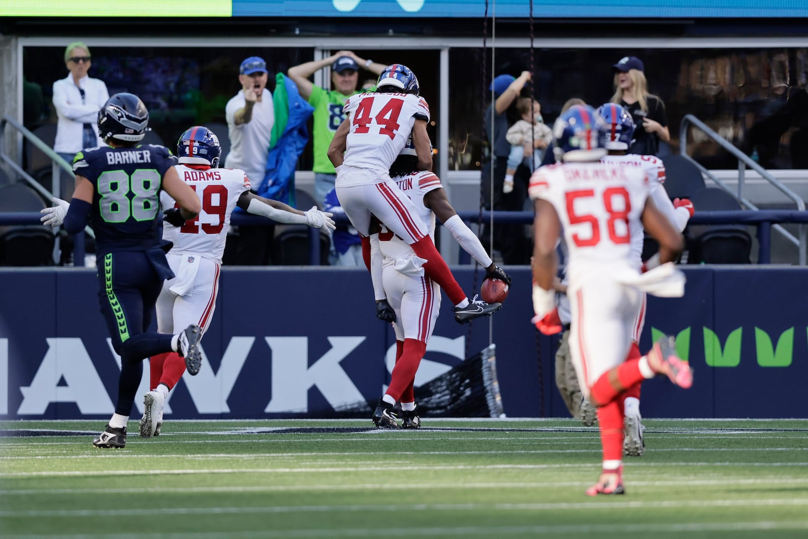 EDS NOTE: OBSCENITY - New York Giants wide receiver Bryce Ford-Wheaton (88), back, center, celebrates with teammates after returning a blocked field goal for a touchdown during the second half of an NFL football game against the Seattle Seahawks, Sunday, Oct. 6, 2024, in Seattle. (AP Photo/John Froschauer)