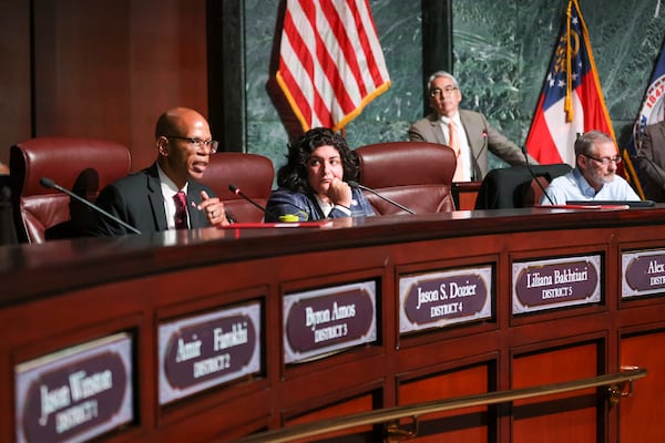 Council member Jason Dozier, left, speaks next to Council member Liliana Bakhtiari on Tuesday, June 6, 2023, in Atlanta. (Jason Getz / Jason.Getz@ajc.com)