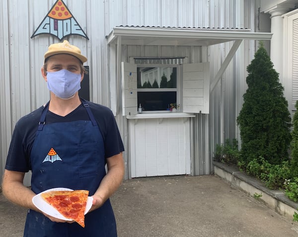 Rob Birdsong in front of his Glide Pizza window on the Eastside Beltline