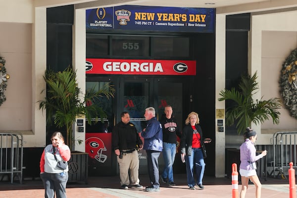 The Georgia Bulldog football team, and many of its fans, are staying at the New Orleans Marriott on Canal Street. Because of the terror attack earlier Wednesday, killing at least 14 and injuring dozens, the team has been sheltering in place before they leave for the Sugar Bowl. (Jason Getz/AJC)