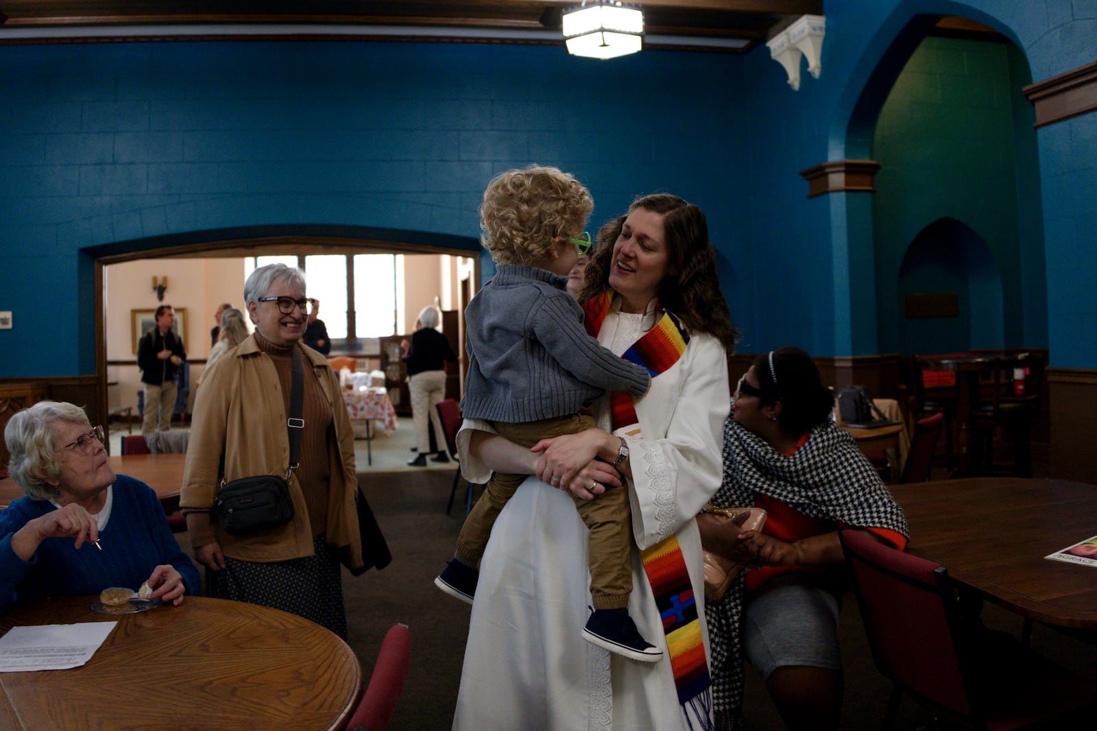 Grace United Methodist Church pastor, the Rev. Anna Layman Knox, meets with members of her congregation at a coffee hour after a service in Harrisburg, Pa., on Sunday, Oct. 27, 2024. (AP Photo/Luis Andres Henao)