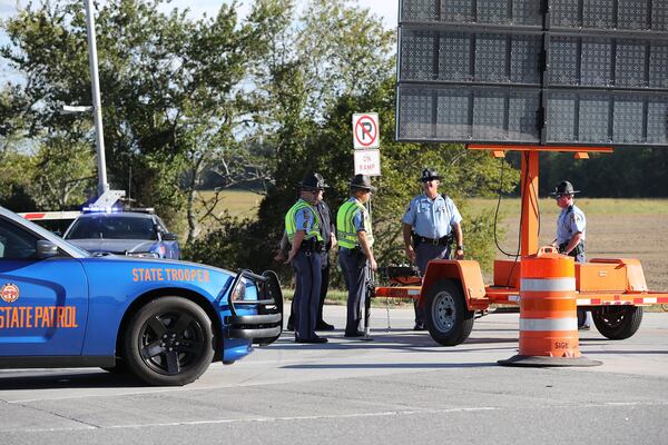 Georgia State Patrol troopers at work, blocking the entrance ramp to I-16 East at Exit 39 because of reversed lanes needed to evacuate the coast of Georgia as Hurricane Matthew approached in October 2016. (credit: Curtis Compton /ccompton@ajc.com)