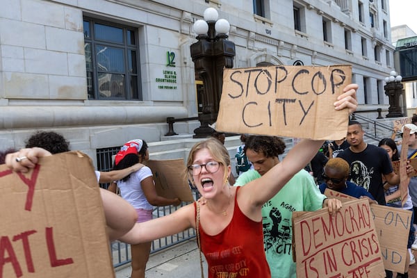 Protestors against Atlanta's planned public safety training center, known by some as "Cop City," gather at Fulton County Courthouse in Atlanta on Monday, Aug. 14, 2023. (Arvin Temkar/The Atlanta Journal-Constitution/TNS)