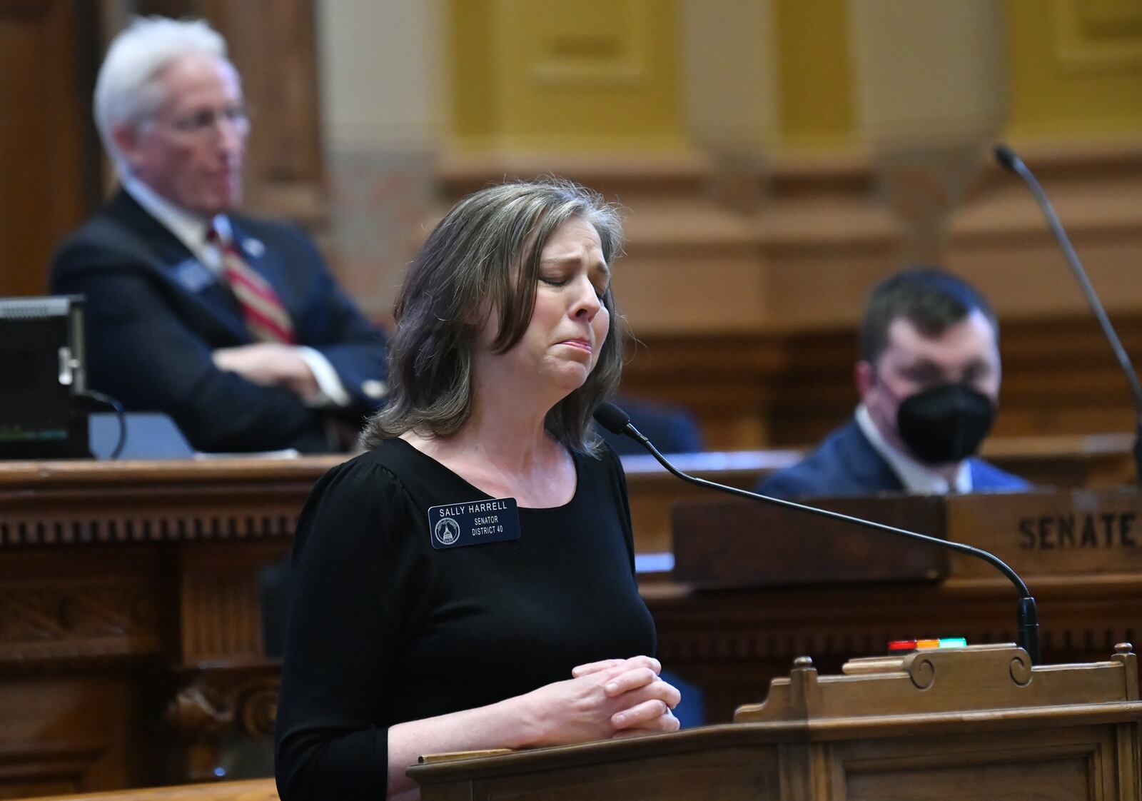 A tearful state Sen. Sally Harrell, D-Atlanta, asked her colleagues not to approve Senate Bill 435, which would require students to participate in high school sports according to the sex that appears on their birth certificate.. “This is an issue that isn’t new, it’s been around a long time, but we’re dealing with it in a new way and we don’t understand it," said Harrell, who has a transgender child. "Let’s not move so fast because this is hurting our kids.” (Hyosub Shin / Hyosub.Shin@ajc.com)