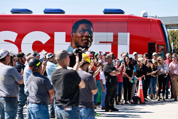 Employees of Battle Lumber Company in Wadley, Georgia, listen to Republican U.S. Senate candidate Herschel Walker speak on Oct. 6, 2022. (Natrice Miller / natrice.miller@ajc.com)  