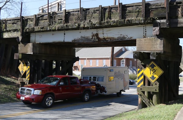 Stone Mountain - An old railroad bridge that crosses James B Rivers Memorial Dr. is shown in Stone Mountain, Georgia on Wednesday, March 20, 2019. The clearance is 12 feet, and there have been 31 incidents here in the last 8 years. EMILY HANEY / emily.haney@ajc.com