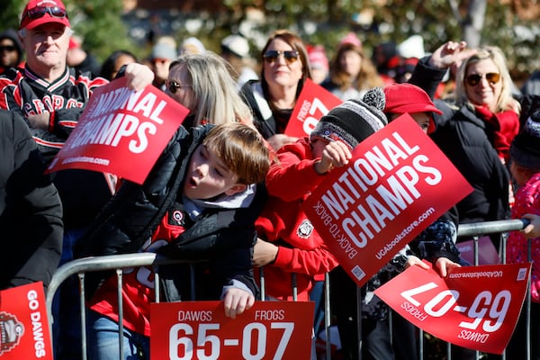 Fans celebrate Georgia’s College Football Playoff national championship during the victory parade in Athens on Saturday, Jan. 14, 2023. The Bulldogs reportedly have yet to receive an invitation to visit the White House in Washington, D.C. (Miguel Martinez/The Atlanta Journal Constitution)