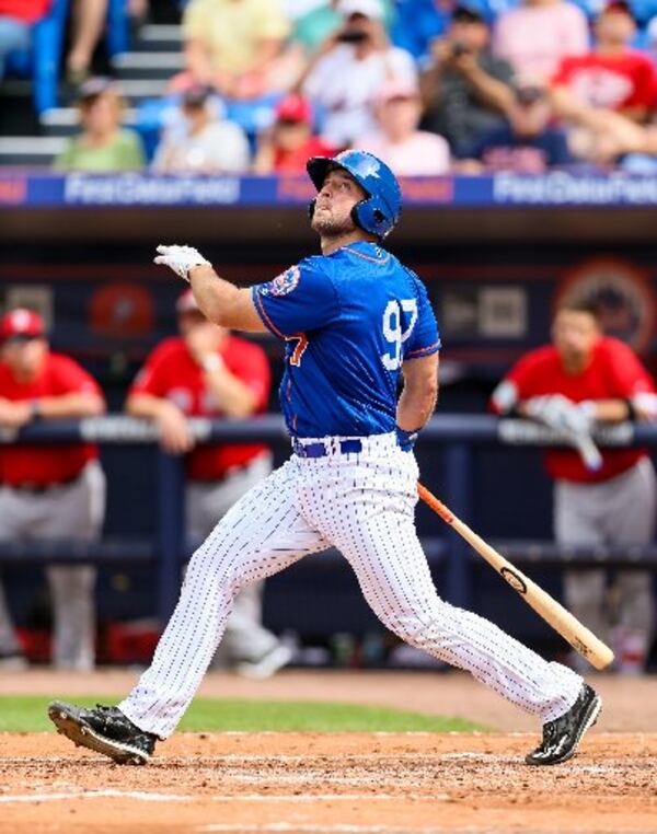 Tim Tebow hits a foul ball during the New York Mets and Boston Red Sox spring training game at First Data Field in Pt. St. Lucie on March 8, 2017. (Richard Graulich / The Palm Beach Post)