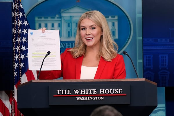 White House press secretary Karoline Leavitt holds a memorandum from the Office of Personnel Management as she speaks during a press briefing in the James Brady Press Briefing Room at the White House, Tuesday, Feb. 25, 2025, in Washington. (AP Photo/Evan Vucci)