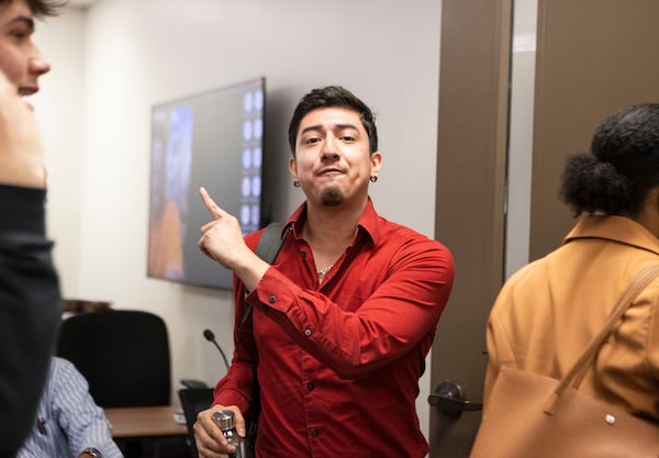 Jonathan Peraza Campos yells at the Georgia Professional Standards Commission members after they voted during their June 8, 2023, meeting to delete words such as "diversity" and "equity" and scores of references to so-called “ambiguous terms” from the rules that guide the colleges and programs that train future educators. (Christina Matacotta for The Atlanta Journal-Constitution)
