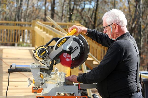 Air Force veteran Mike Satterly volunteers with the Cherokee County Homeless Veteran Program to build a handicap ramp at the future home of a disabled veteran on Friday, November 20, 2020, in Canton, Georgia. The program is run by Army veteran John Lindenmayer, and is a part of a nationwide patchwork of volunteer veterans helping other veterans in need. CHRISTINA MATACOTTA FOR THE ATLANTA JOURNAL-CONSTITUTION