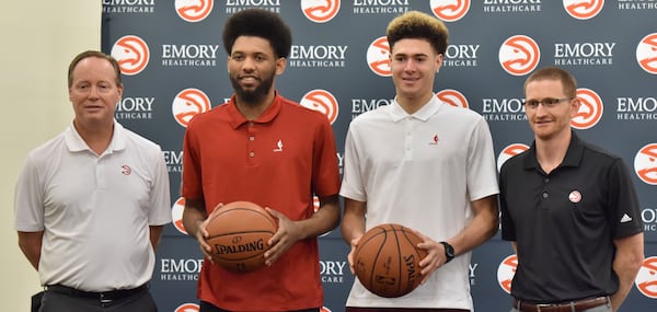 DeAndre’ Bembry (center left) and Isaia Cordinier (center right) pose with head coach Mike Budenholzer (left) and general manager Wes Wilcox during a press conference following the NBA Draft on Tuesday, June 28, 2016. Hyosub Shin / hsin@ajc.com