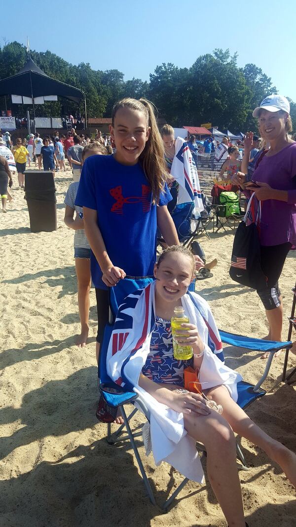 Grace Bunke and her sister Caroline after the Swim Across America event last year. CONTRIBUTED