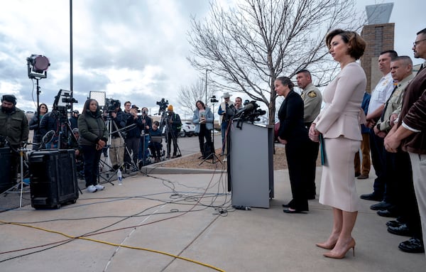 Dr. Erin Phipps, New Mexico State Veterinarian with the New Mexico Department of Health, at podium, Santa Fe County Sheriff, Adan Mendoza, and Dr. Heather Jarrell, chief medical investigator for the New Mexico Office of the Medical Investigator, center, hold a news conference to talk about the cause of death for Gene Hackman and his wife Betsy Arakawa in Santa Fe, N.M. (Eddie Moore/The Albuquerque Journal via AP)