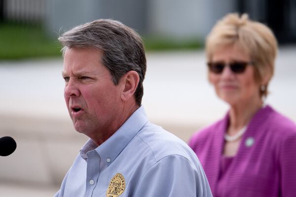 Gov. Brian Kemp delivers updates and answers journalists’ questions during a press conference outside of the State Capitol on Monday afternoon April 13, 2020. Listening in the background is Dr. Kathleen Toomey, commissioner of the Georgia Department of Public Health. BEN@BENGRAY.COM FOR THE ATLANTA JOURNAL-CONSTITUTION