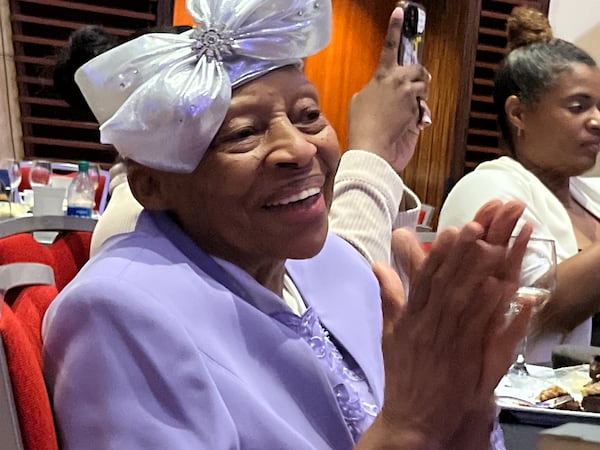 Arline Taylor claps for her daughter, Ruby "Sunshine" Taylor, who was among entrepreneurs with disabilities honored by a metro Atlanta nonprofit, Synergies Work, for their boldness as business owners. Matt Kempner / AJC