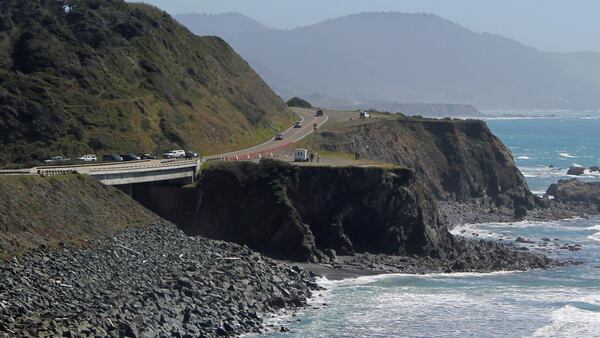 Investigators with the California Highway Patrol work at the scene where a couple and several of their children plunged in their SUV off Highway 1, Wednesday, March 28, 2018, near Fort Bragg, Calif. Searchers scoured the Northern California coast Wednesday for the missing children of a couple who were killed along with three of their other children when their SUV plunged off scenic Pacific Coast Highway onto rocks in the ocean. 