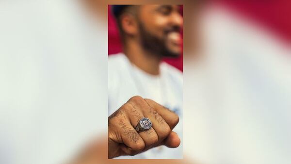 Chris Kinney's Olympic ring was among the items stolen from his apartment in Roswell.