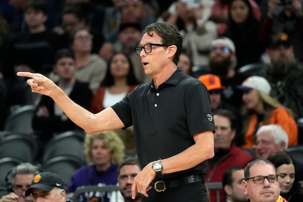 Atlanta Hawks head coach Quin Snyder gives instructions to his players during the first half of an NBA basketball game against the Phoenix Suns Thursday, Jan. 9, 2025, in Phoenix. (AP Photo/Ross D. Franklin)