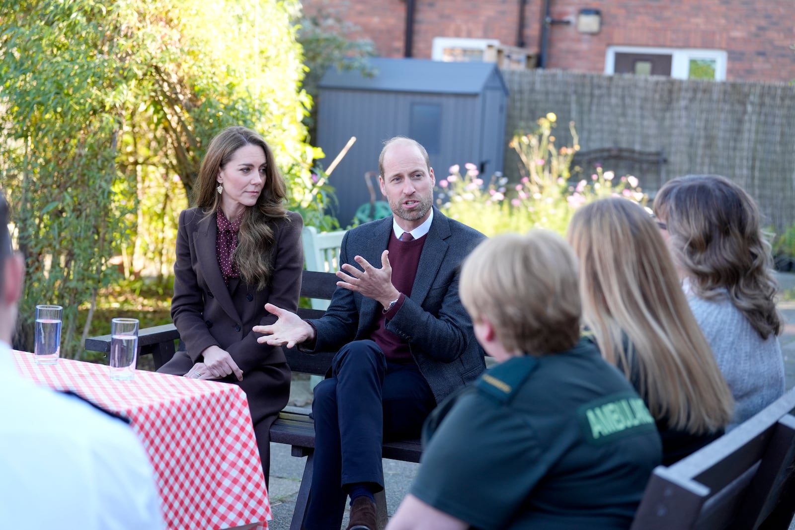 Britain's Prince William and Kate, Princess of Wales, speak to members of the emergency services during a visit to Southport Community Centre to meet rescue workers and the families of those caught up in the Southport knife attack earlier this year, in Southport, England, Thursday, Oct. 10, 2024. (Danny Lawson, Pool Photo via AP)