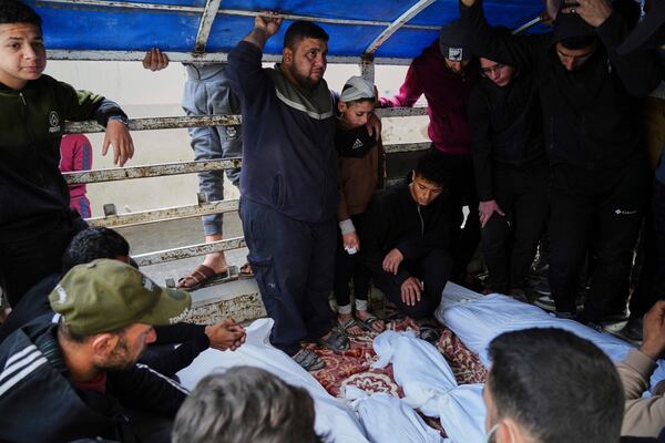 Mourners carry the bodies of Al-Mashharawi family members, who were killed in an Israeli airstrike that hit their home, at Al-Ahli Hospital in Gaza City on Saturday, March 22, 2025. (AP Photo/Jehad Alshrafi)