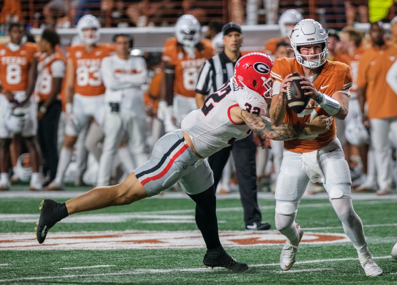 Texas quarterback Quinn Ewers (3) is sacked for a loss by Georgia linebacker Chaz Chambliss (32) during the second half of an NCAA college football game in Austin, Texas, Saturday, Oct. 19, 2024. (AP Photo/Rodolfo Gonzalez)