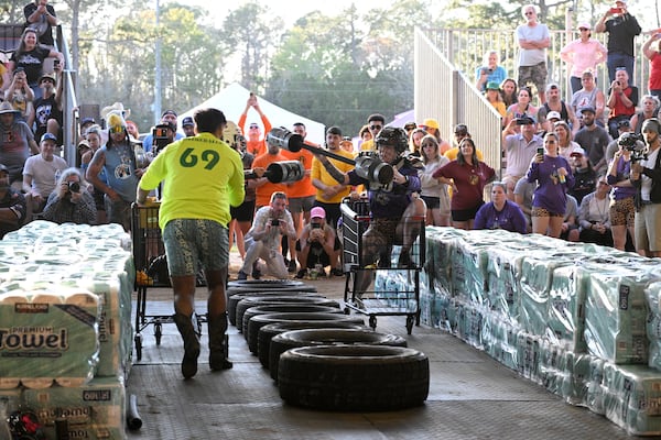 Teams compete in the Hurricane Party Prep: Grocery Aisle Brawl during the Florida Man Games, Saturday, March 1, 2025, in Elkton, Fla. (AP Photo/Phelan M. Ebenhack)