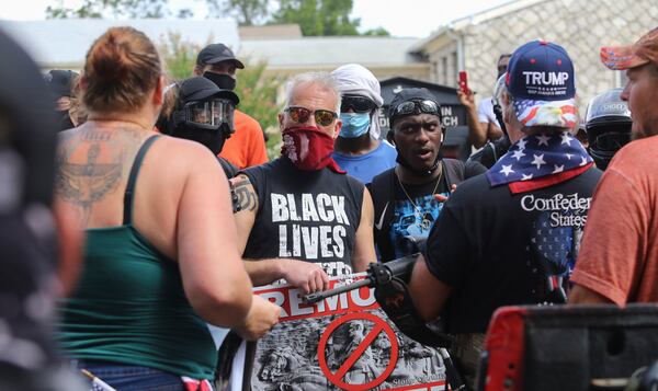 8/15/20 - Stone Mountain, GA - Protestors and counter protestors face off  as several far-right groups, including militias and white supremacists, rally Saturday in the town of Stone Mountain, and a broad coalition of leftist anti-racist groups organized a counter-demonstration there after local authorities closed Stone Mountain park.   Jenni Girtman for the Atlanta Journal Constitution