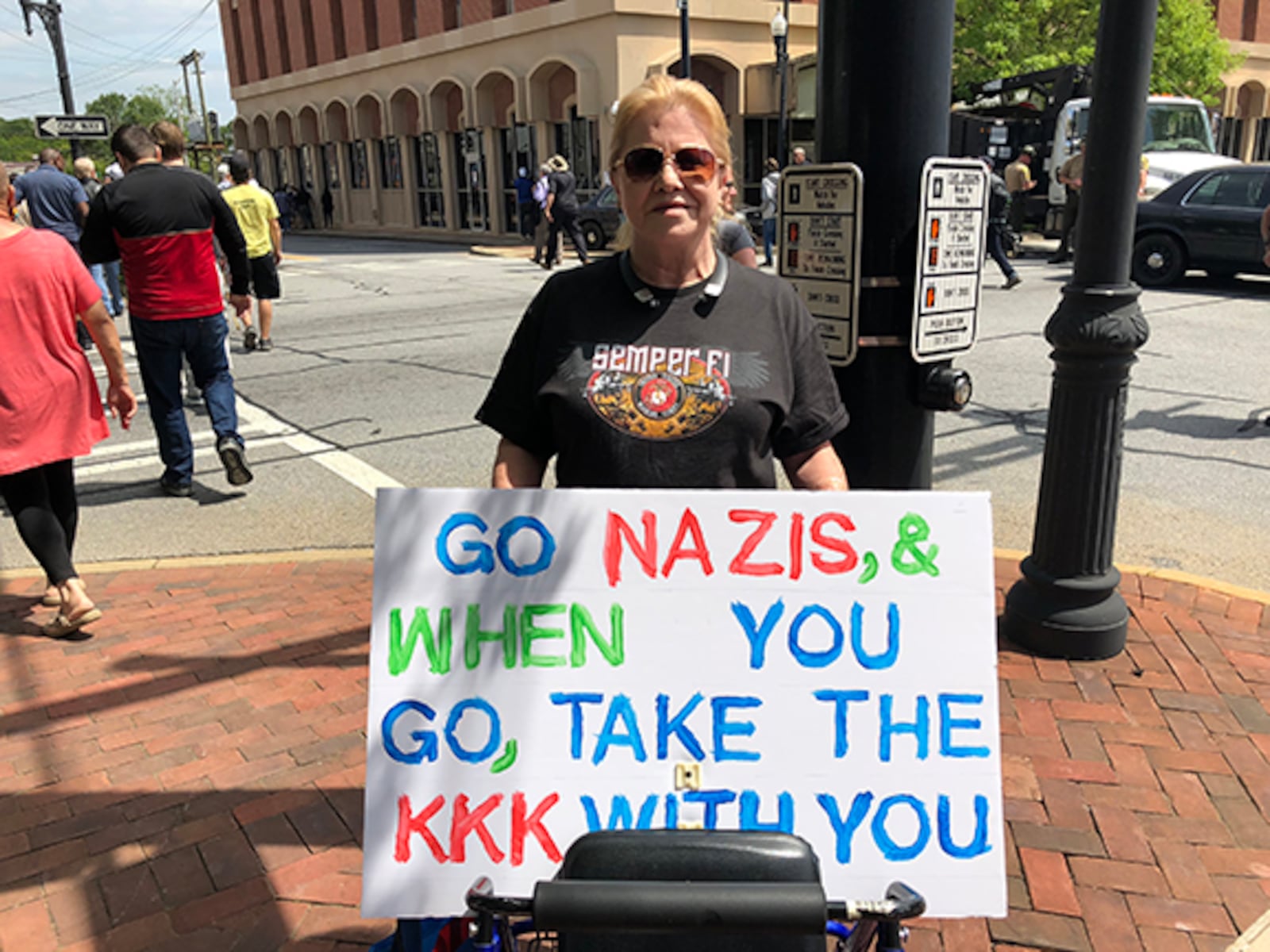 Dee Wyman of Marietta participates in a counterprotest in Newnan on Saturday.