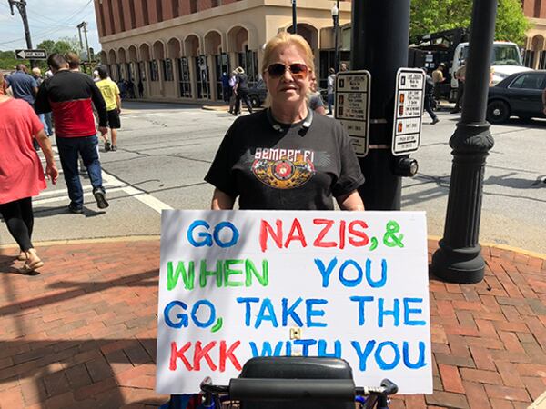 Dee Wyman of Marietta participates in a counterprotest in Newnan on Saturday.