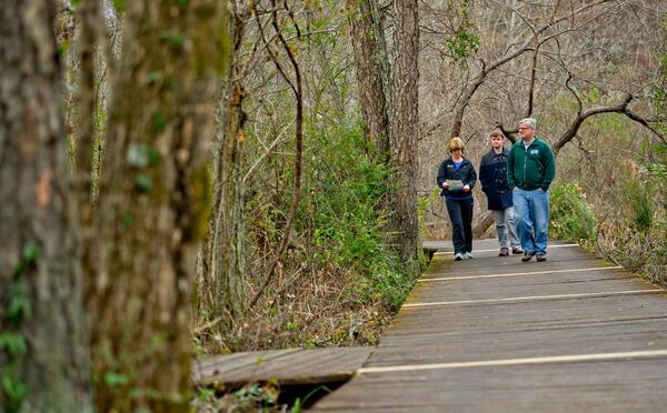 Philomena Strenger (left), her son Anton and husband Carl hike along the River Boardwalk Trail at the Chattahoochee Nature Center in Roswell on Saturday, December 27, 2014. JONATHAN PHILLIPS / SPECIAL