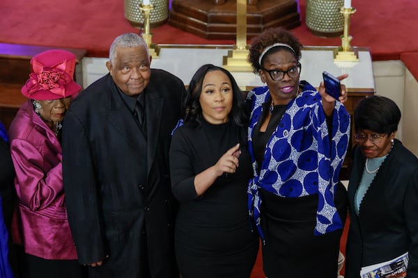 Fulton County DA Fani Willis signals at the balcony moments before the worship service, where she was invited to speak on Sunday, January 14, 2024. 
Miguel Martinez /miguel.martinezjimenez@ajc.com