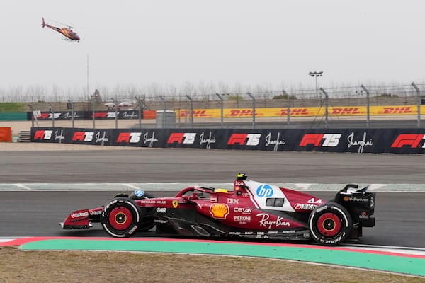 Ferrari driver Lewis Hamilton of Britain steers his car during the Chinese Formula One Grand Prix race at the Shanghai International Circuit, Shanghai, Sunday, March 23, 2025. (AP Photo)