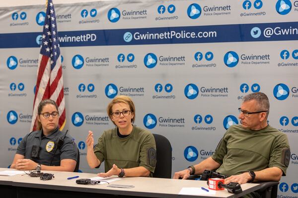 Tracey Reed (from left), Danielle Bell and Bryan Reavis discuss the standoff Friday.