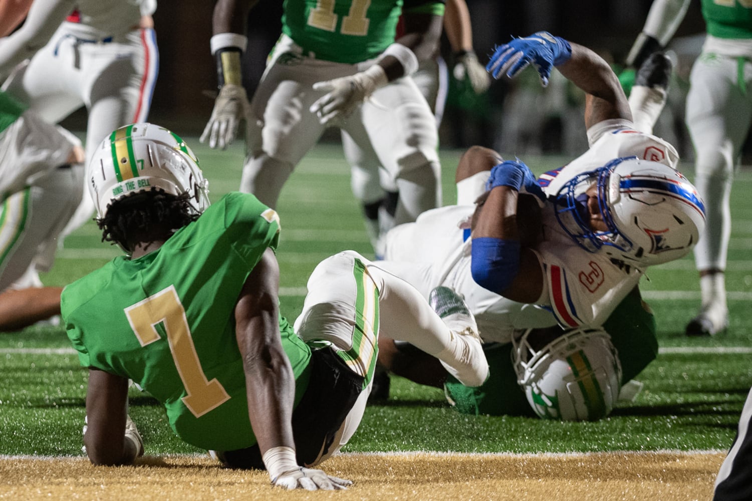 Makari Bodiford, running back for Walton, is tackled. (Jamie Spaar for the Atlanta Journal Constitution)