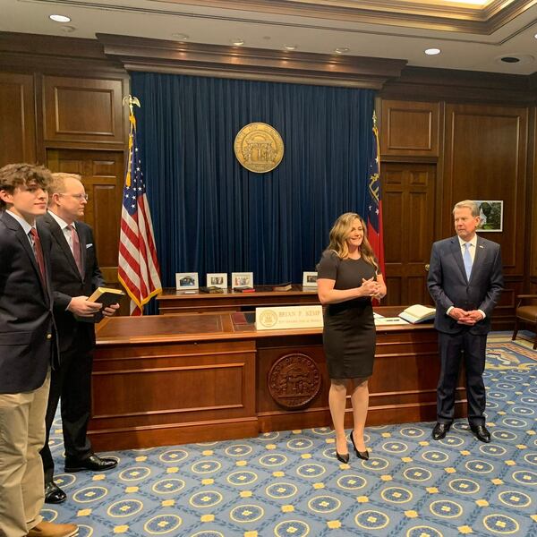 Shannon Wallace (center) was sworn in Monday by Gov. Brian Kemp as superior court judge for the Blue Ridge judicial circuit.