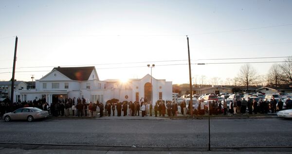 FILE - The sun goes down behind the funeral home as mourners line up for the funeral of Kenzie Houk in New Castle, Pa., Feb. 24, 2009. (AP Photo/Keith Srakocic, File)