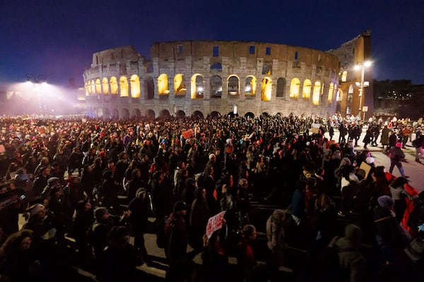 People take part in a rally ahead of the International Day for the Elimination of Violence against Women, in front of the Colosseum in Rome, Saturday, Nov. 23, 2024.. (Roberto Monaldo/LaPresse via AP)