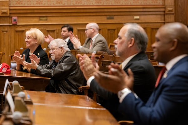 Georgia Republican electors clap,, Tuesday, Dec. 17, 2024, as they gathered in the Senate chambers at the state Capitol in Atlanta to formally cast their votes for Donald Trump and JD Vance. (Arvin Temkar/Atlanta Journal-Constitution via AP)