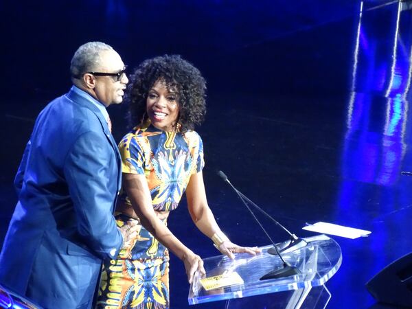 Ed Gordon, who does regular commentaries for Harvey's morning show, and actress Wendy Raquel Robinson, whose show "The Game" just finished its run here in Atlanta, present the best high school. CREDIT: Rodney Ho/ rho@ajc.com