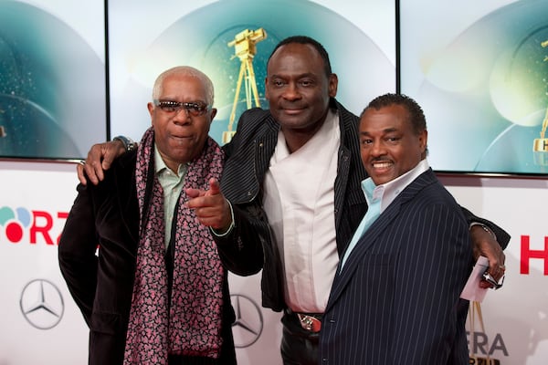 Members of the band Kool & the Gang, from left, Larry Marano, Ronald Bell and Robert Bell arrive on the red carpet for the Goldene Kamera (Golden Camera) media awards in Berlin, Germany, Saturday, Feb. 1, 2014.  (AP Photo/Axel Schmidt)