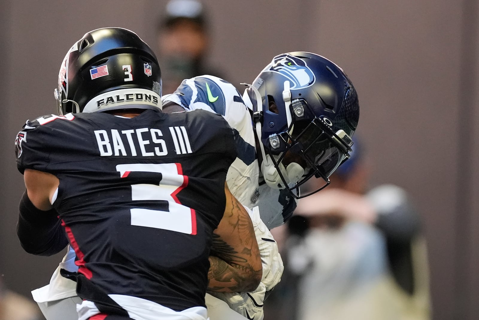 Seattle Seahawks wide receiver DK Metcalf (14) makes a catch for a touchdown as Atlanta Falcons safety Jessie Bates III (3) defends during the first half of an NFL football game, Sunday, Oct. 20, 2024, in Atlanta. (AP Photo/ Mike Stewart )