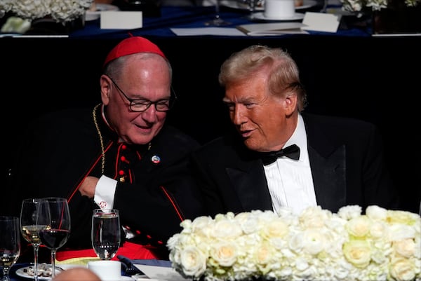 Republican presidential nominee former President Donald Trump talks with Cardinal Timothy Dolan at the 79th annual Alfred E. Smith Memorial Foundation Dinner, Thursday, Oct. 17, 2024, in New York. (AP Photo/Julia Demaree Nikhinson)