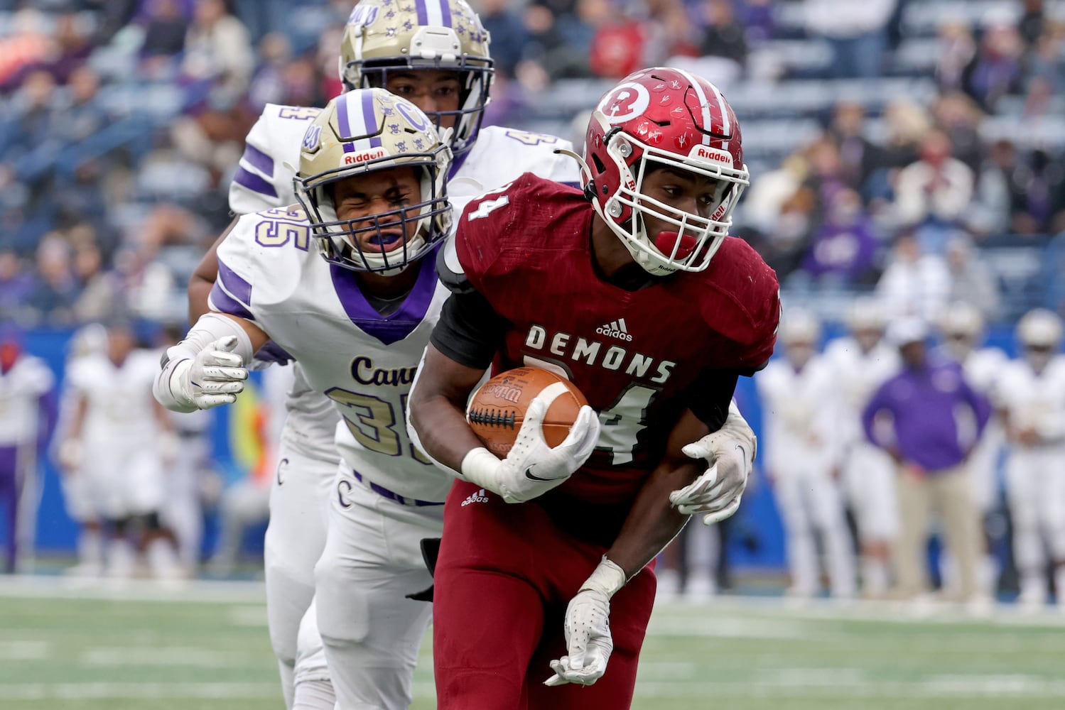 Warner Robins running back Malcom Brown (24) scores a receiving touchdown against Carterville linebacker Rashar Locklear (35) in the first half during the first half of the Class 5A state high school football final at Center Parc Stadium Wednesday, December 30, 2020 in Atlanta. JASON GETZ FOR THE ATLANTA JOURNAL-CONSTITUTION