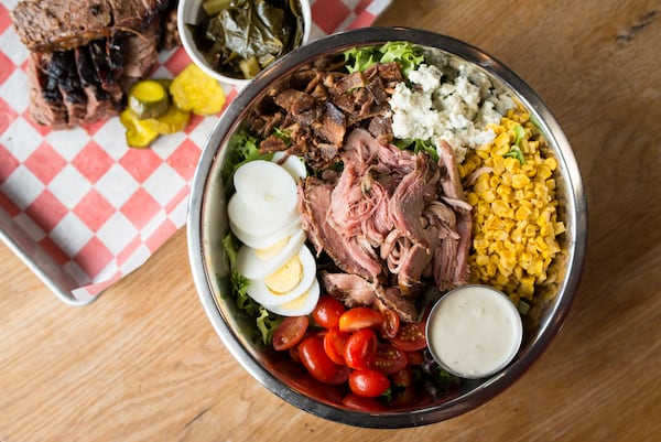 King Barbecue Cobb Salad with mixed greens, tomato, blue cheese, bacon, egg, roasted corn, and chopped turkey. Photo credit- Mia Yakel.