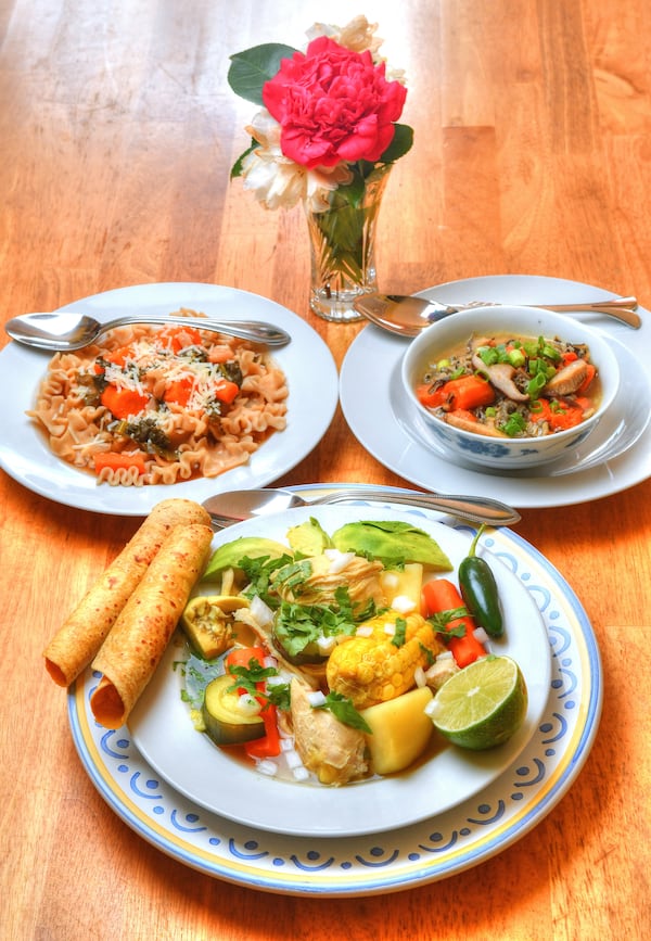 Some options to warm up your winter nights include Mexican Chicken Soup (foreground), Minestrone Soup (rear left), and Shiitake Mushroom, Wild Rice, Ginger and Miso Soup (rear right). (Styling by Jennifer Zyman / photo by Chris Hunt for the AJC)